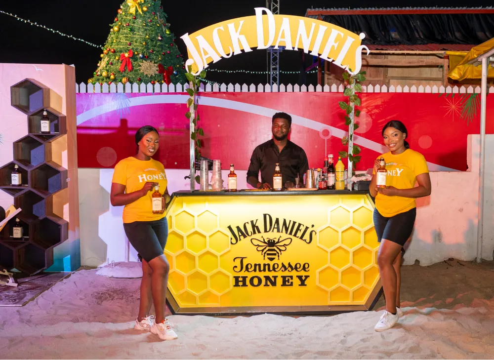 Jack Daniel's Tennessee Honey bar with two brand ambassadors at an evening activation